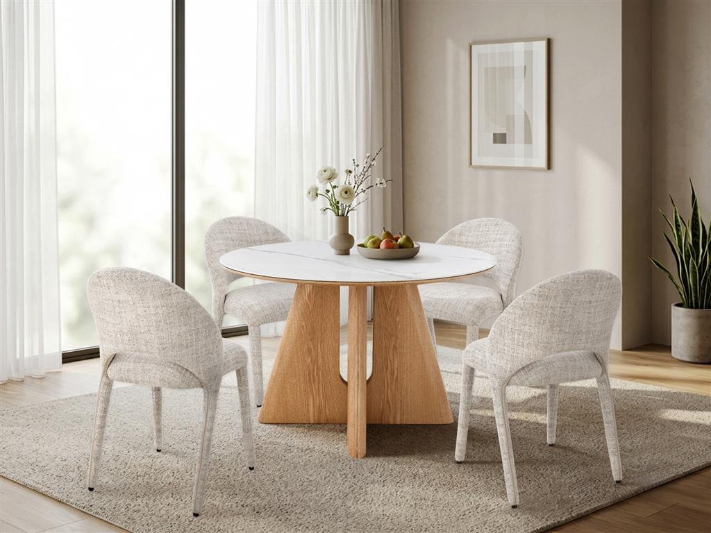 Cypress round dining table styled with stone fabric dining chairs in a bright dining room